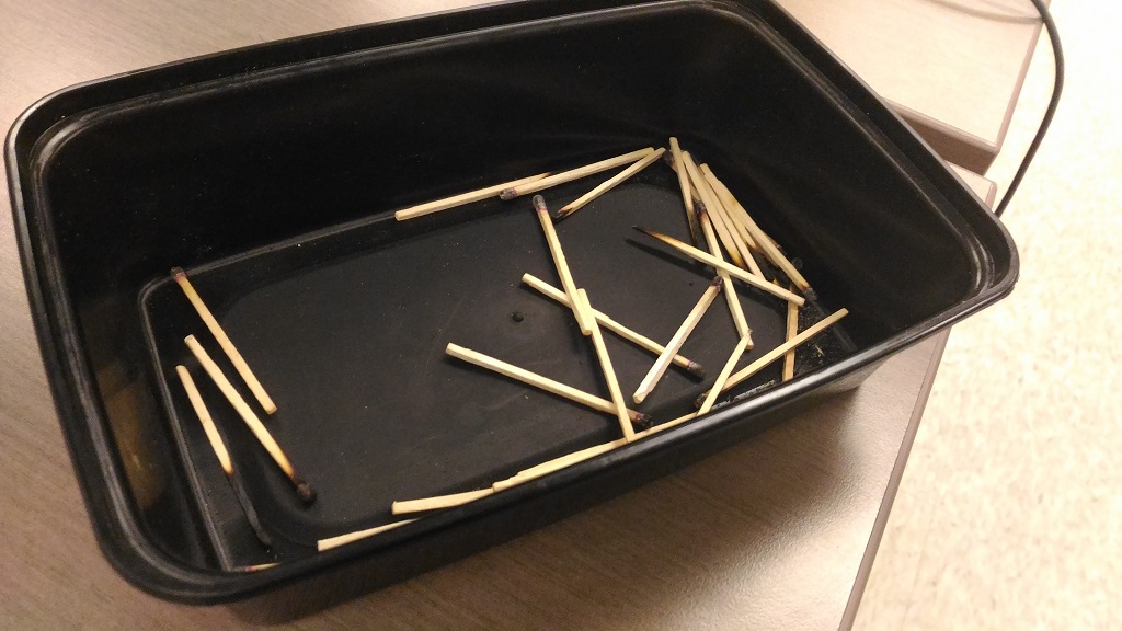 container full of used matches