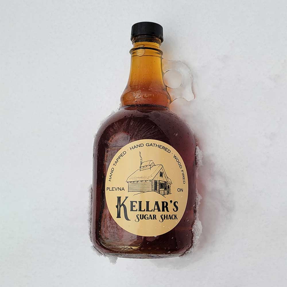 Maple syrup bottle in the snow
